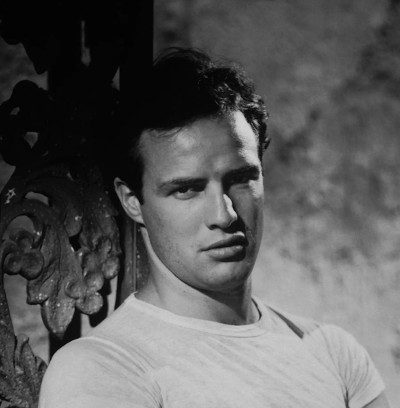 A black and white portrait of a young Marlon Brando